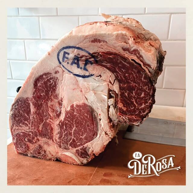 A USDA Prime rib roast stamped with the F.A. DeRosa brand
