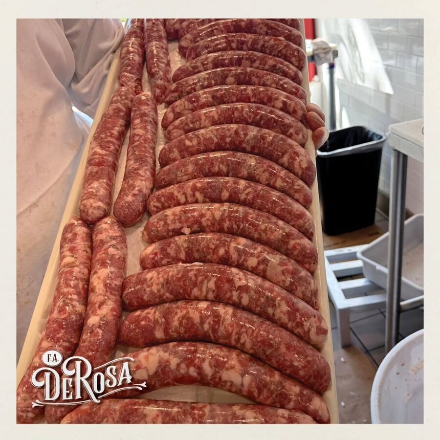 Trays of homemade Italian sausage links