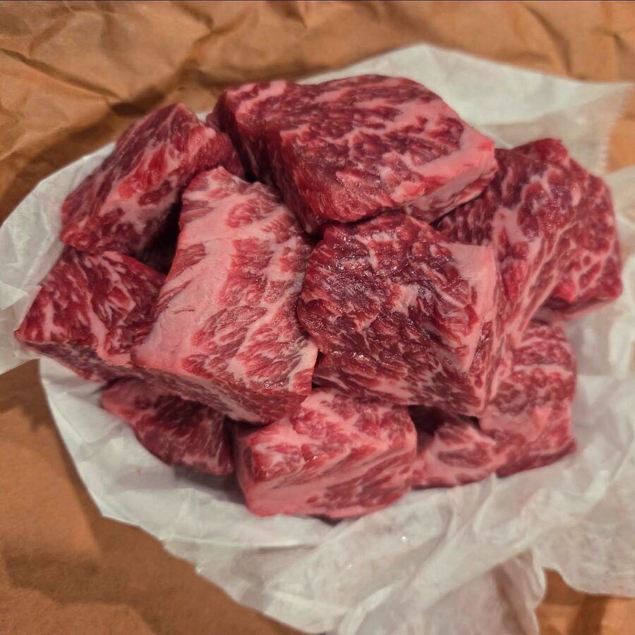 Heavily marbled USDA Prime chuck short rib chunks on butcher paper